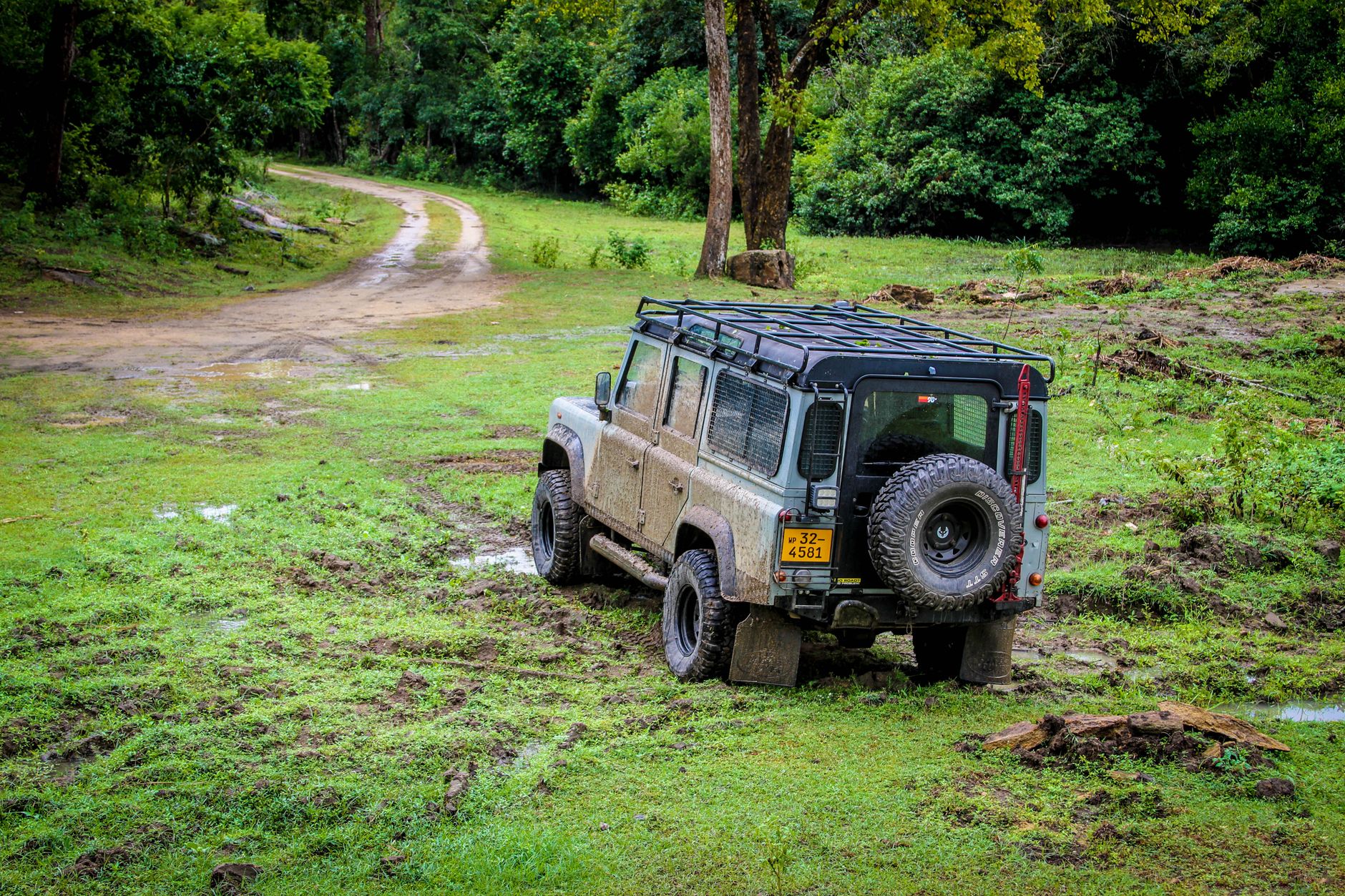 black suv on muddy grass field